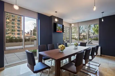 a dining room with a table and chairs at Global Luxury Suites at The Marc in New York