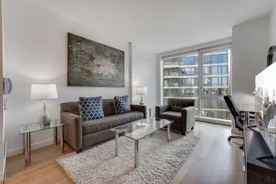 a living room with a couch and a table at Global Luxury Suites at Via 57 in New York