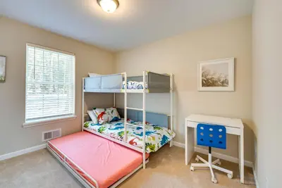 a bedroom with a bunk bed and a desk at Hike and Ski Pocono Lake Home with Community Perks! in Pocono Lake