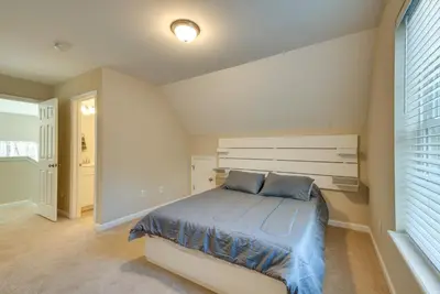 a bedroom with a bed with blue sheets and a window at Hike and Ski Pocono Lake Home with Community Perks! in Pocono Lake