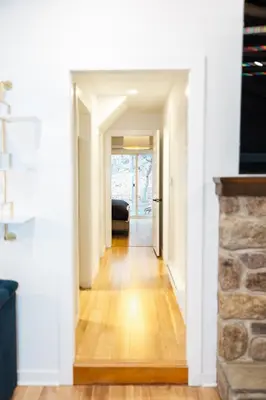 a hallway leading to a living room with white walls at Cowry Acres - 11 Acre Enchanted Retreat, Hot Tub in New Hope
