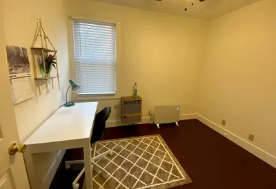 an empty room with a desk and a window at Chic Catskills Getaway Bungalow in Hurleyville