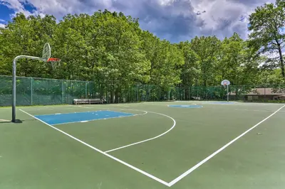 a court with a basketball hoop on a tennis court at Walk to Lake Wallenpaupack Poconos Vacation Home in Lake Ariel