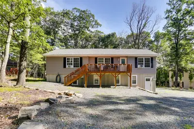 a house with a deck on the front of it at Walk to Lake Wallenpaupack Poconos Vacation Home in Lake Ariel